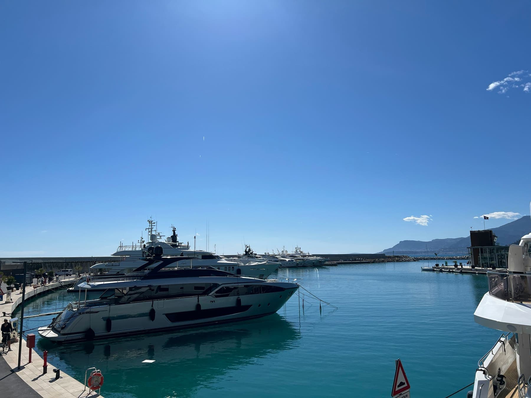 Superyachts docked in a harbour at dusk